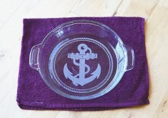 Set sail for style and sweetness with this Nautical Anchor Engraved Pie Plate!